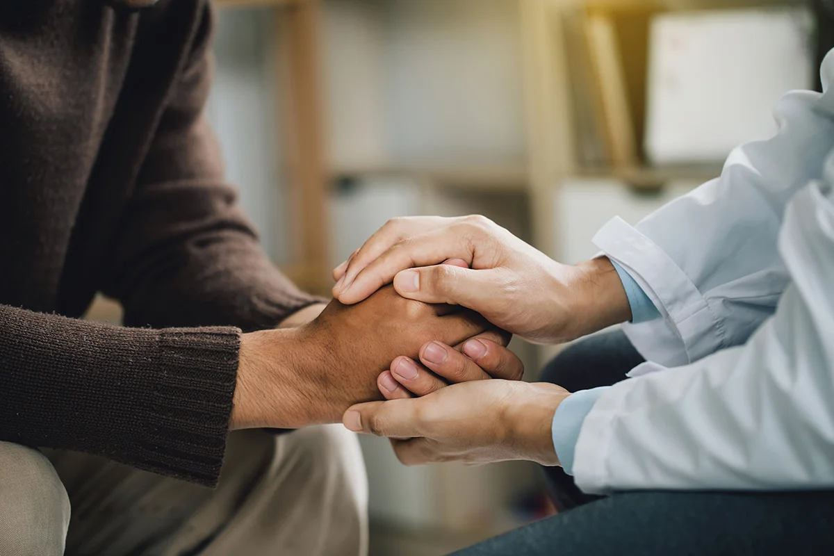 Hands of people in aftercare support