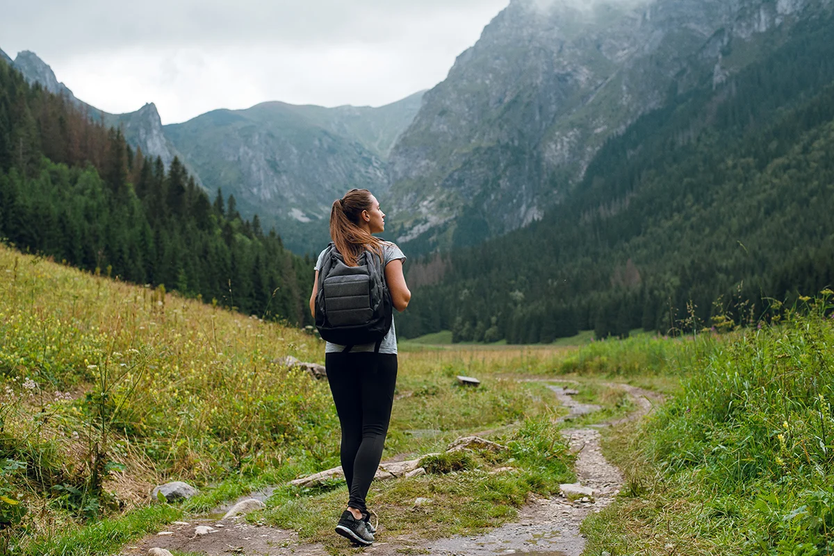 Person hiking outside while benefiting from medication-assisted treatment