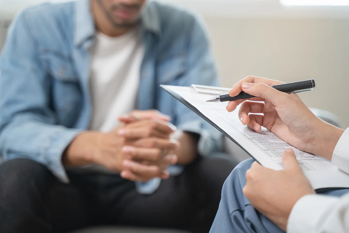 Hands of people talking about medication-assisted treatment