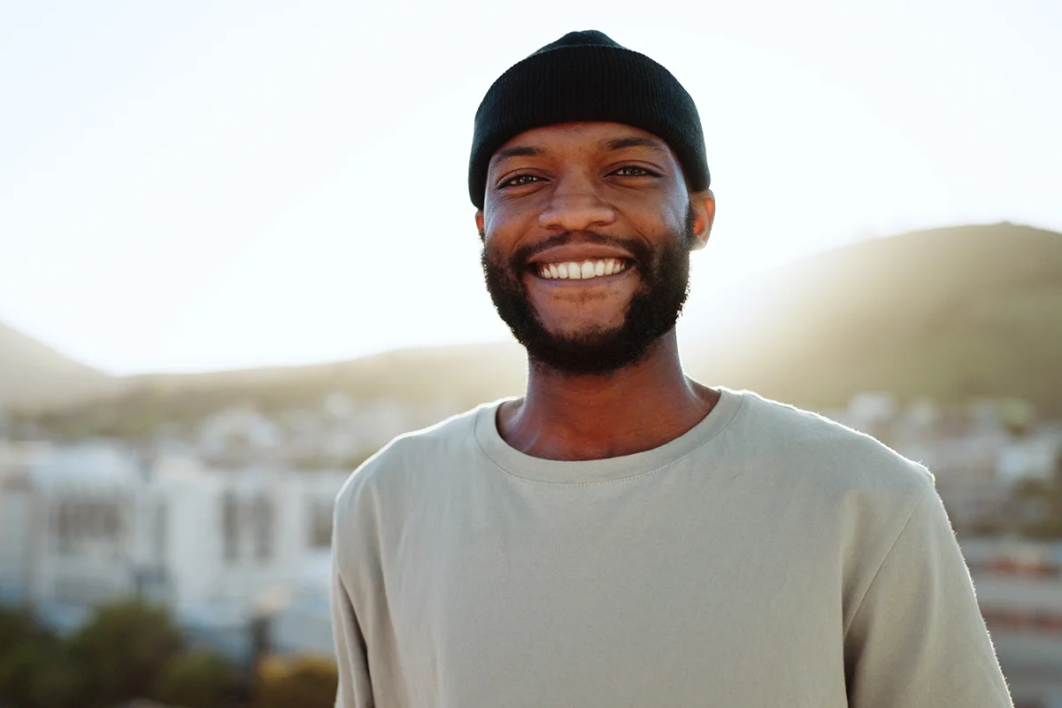 Person smiling after paying for addiction treatment
