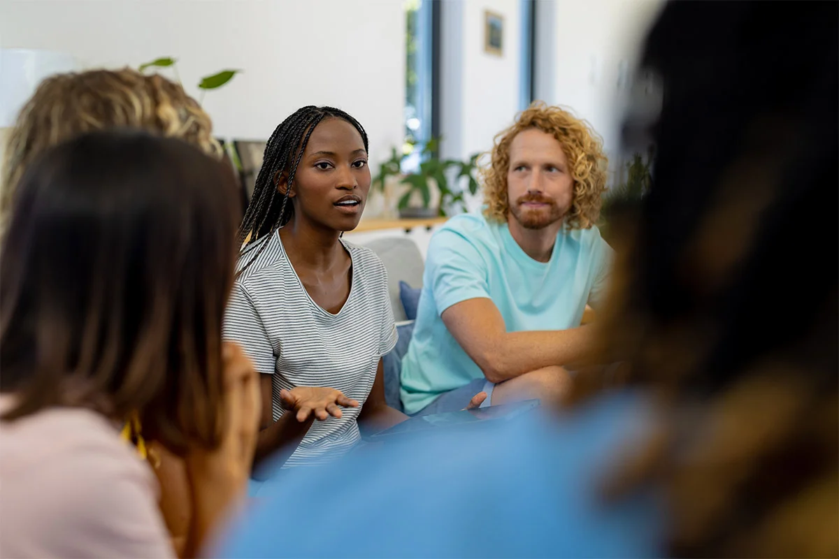 Woman sharing in group therapy